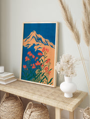 Illustrative orange mountain with red flowers and green leaves against a blue sky, in a bold botanical wall art print. - Image 3