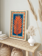 Orange palm leaf illustration against deep blue background with Art Deco geometric border on, in an alternate framed mockup