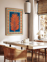 Orange palm leaf illustration against deep blue background with Art Deco geometric border on beige, in a styled room mockup