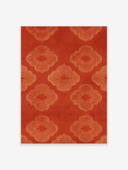 Orange quatrefoil pattern wall art with repeating geometric lattice motifs on a textured background
