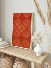Orange quatrefoil pattern wall art with repeating geometric lattice motifs on a textured, in an alternate framed mockup