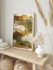 Abstract wall art print with organic shapes in brown, tan, and muted green-grey, on a, in an alternate framed mockup