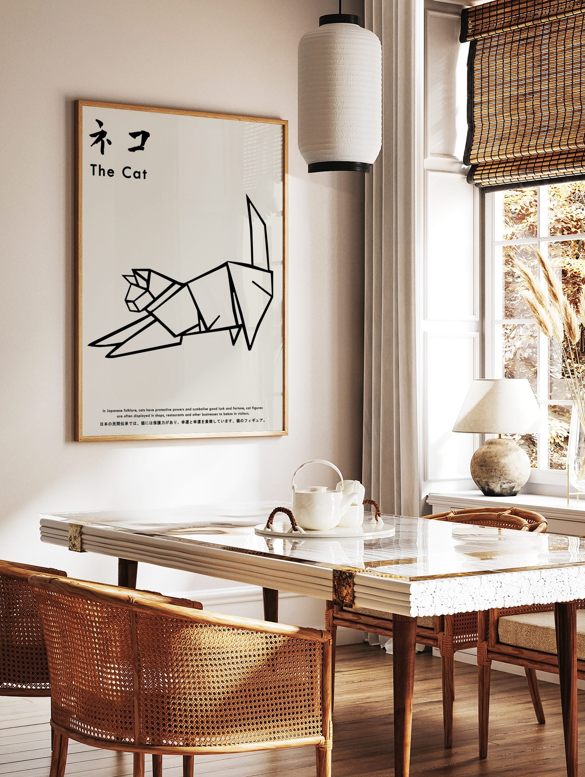 Minimalist black and white origami cat illustration art print with Japanese text, displayed as the same artwork in a styled poster mockup for home decor