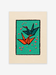 Two origami cranes, one teal and one orange, flying on a green background with red petals, framed by black and cream borders.