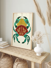 Ornate crab illustration wall art in teal, red, and gold with botanical patterns on a, in an alternate framed mockup
