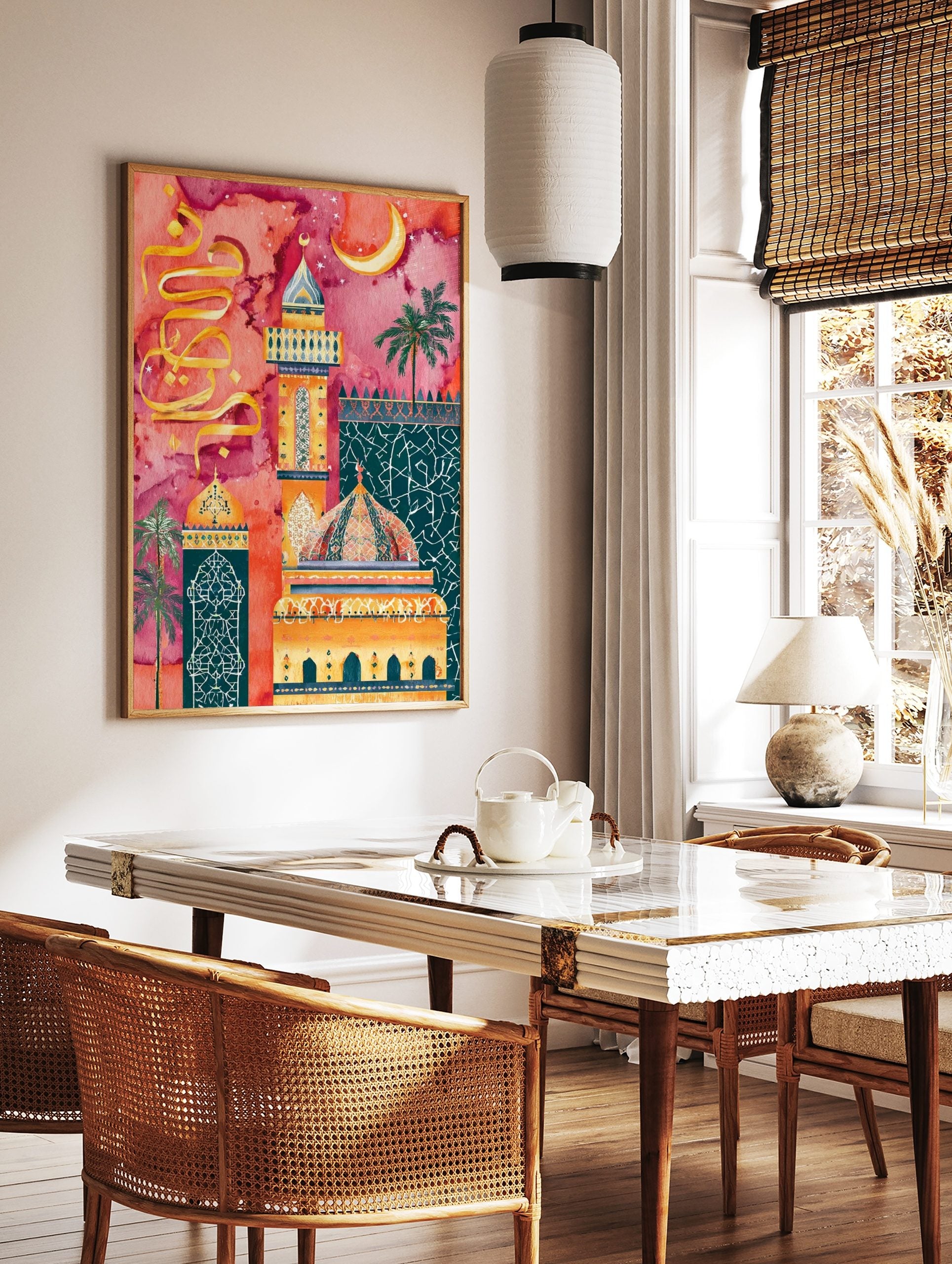 Ornate Islamic mosque minaret and dome with golden Arabic calligraphy against a vibrant pink and, in a styled room mockup