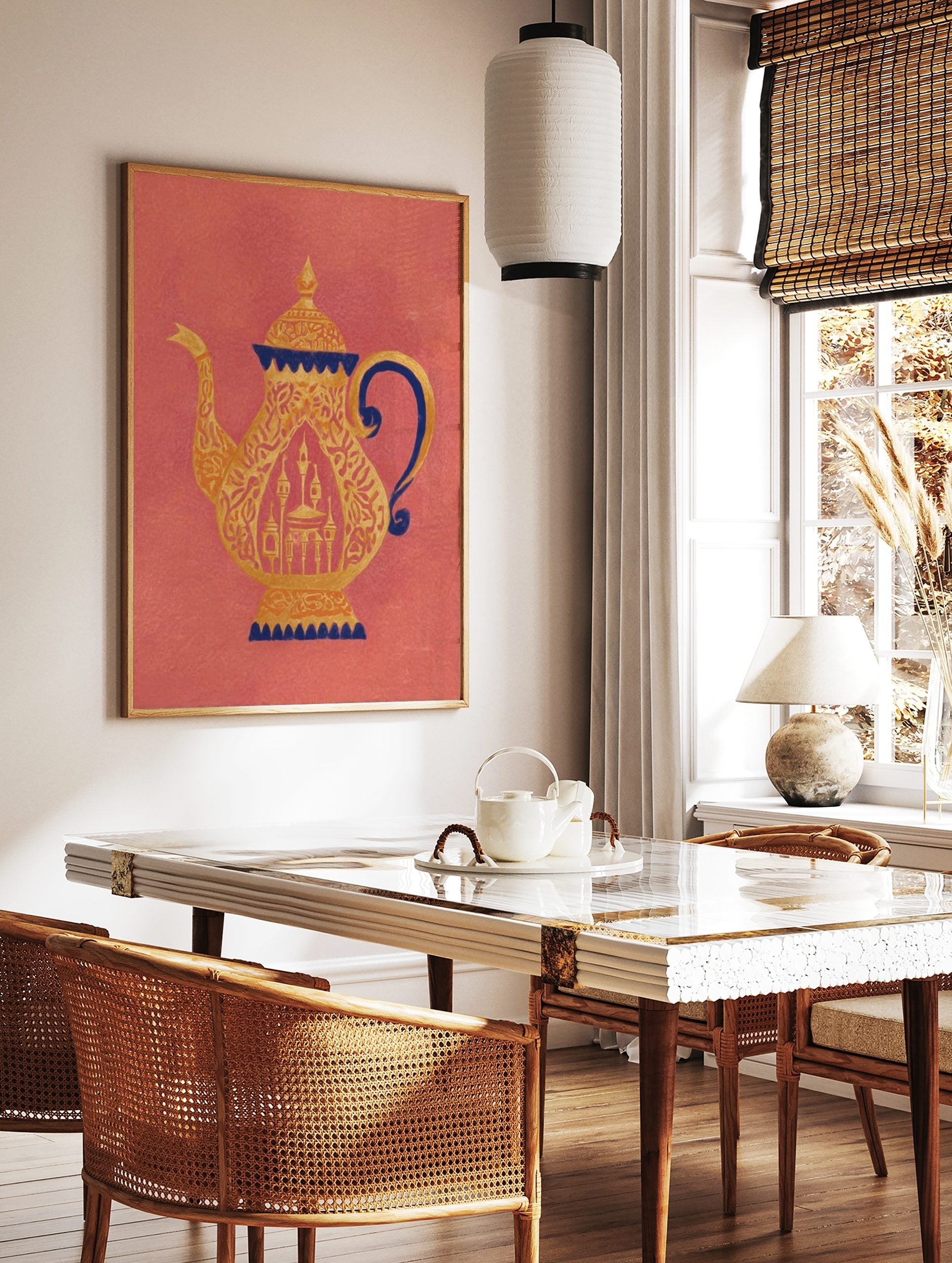 Ornate golden teapot with dark blue accents and intricate patterns on a coral background, showing a, in a styled room mockup