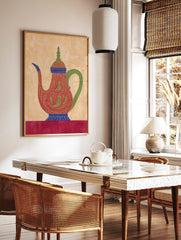 Ornate red teapot illustration with green patterns, blue accents, and a green handle on a beige, in a styled room mockup