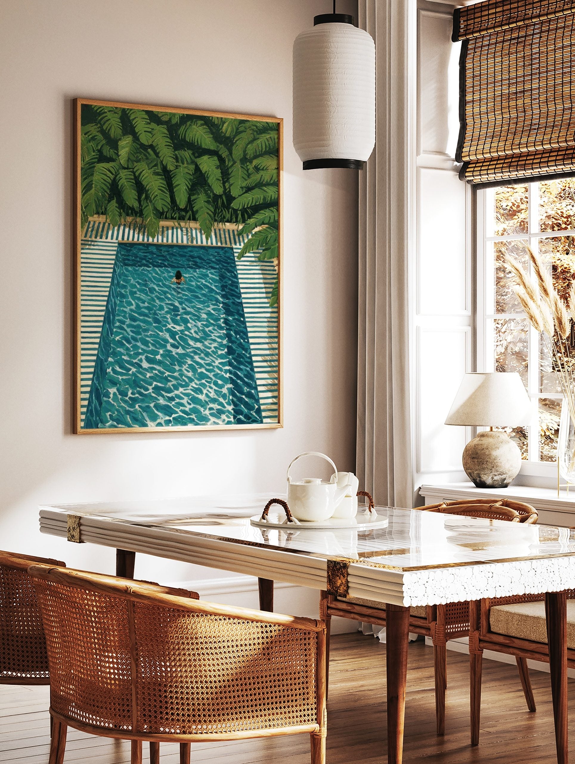 Overhead painting of a person swimming in a turquoise pool with green tropical leaves and striped, in a styled room mockup