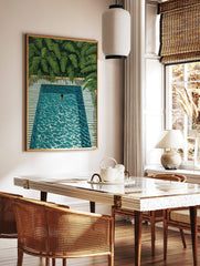 Overhead painting of a person swimming in a turquoise pool with green tropical leaves and striped, in a styled room mockup