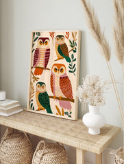 Illustrated owl art print featuring four colorful owls with patterned feathers perched on tree branches against a light background. - Image 3