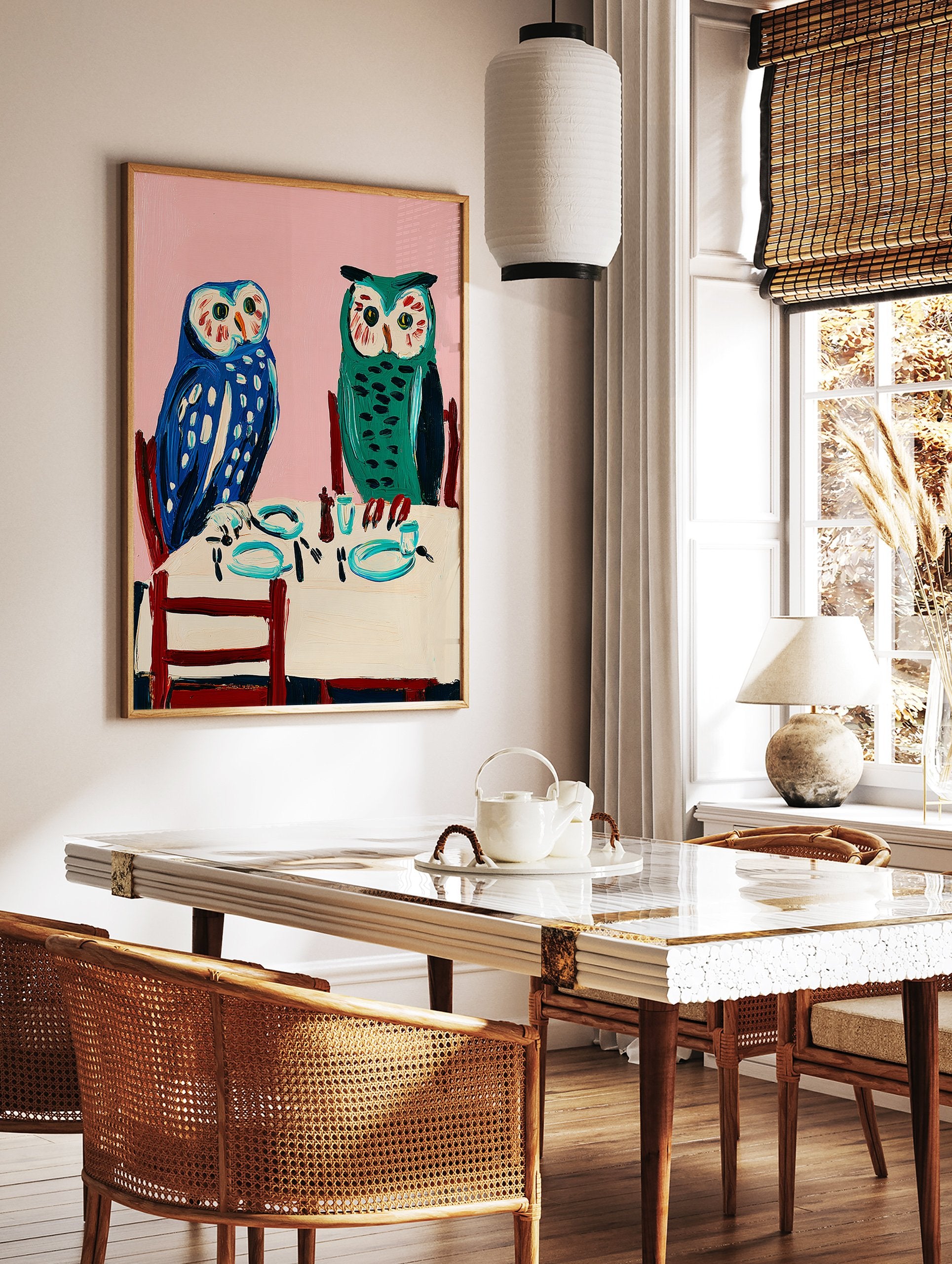 Owl wall art painting featuring two blue and green owls seated at a dining table with a pink background. - Image 2