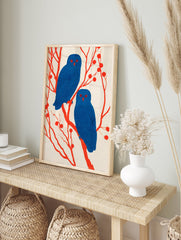Illustrative owl wall art featuring two blue owls with red eyes perched on red branches with berries against a light background. - Image 3