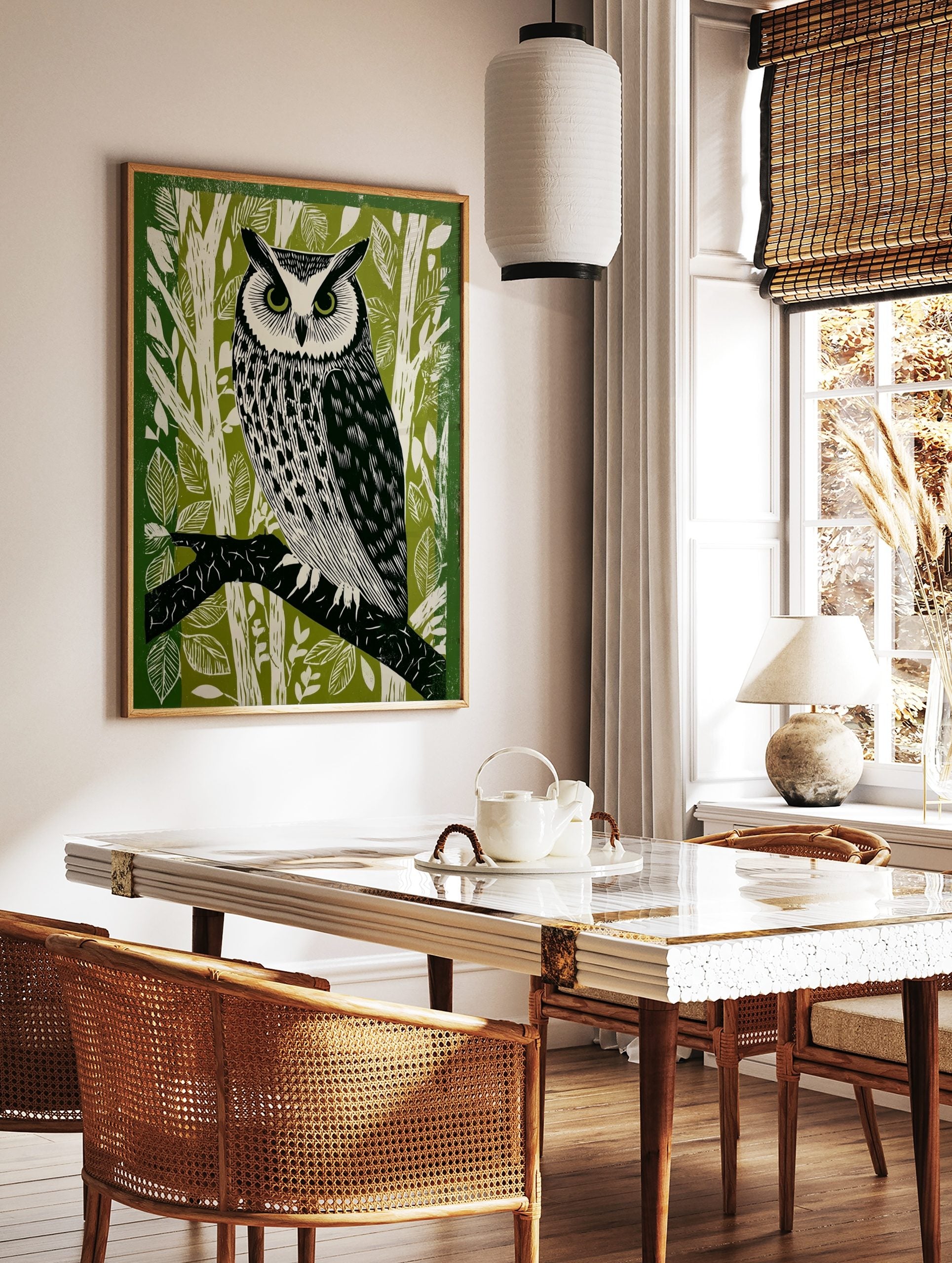 Illustrative long-eared owl perched on a branch, green and white forest background linocut style, in a styled room mockup