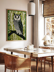 Illustrative long-eared owl perched on a branch, green and white forest background linocut style, in a styled room mockup