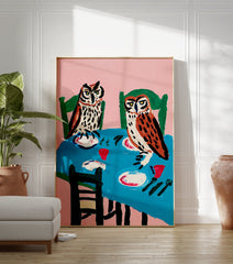 Illustrative owl wall art painting depicting two owls sitting at a dinner table with plates and cups against a pink background. - Image 3