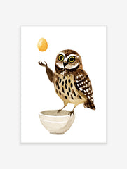 Illustrated wall art print of a brown speckled owl balancing a golden egg above a white bowl on a white background