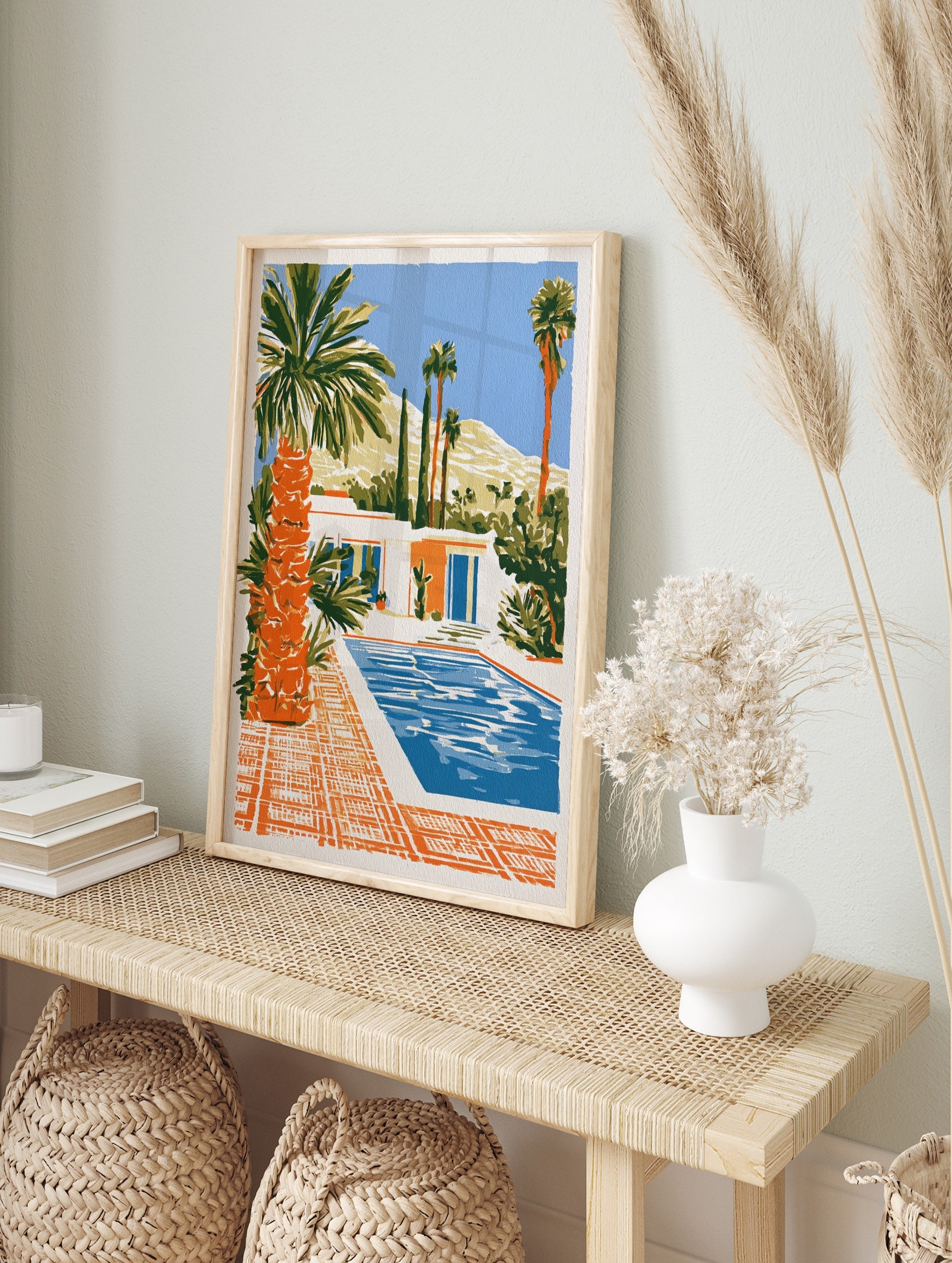 Illustrative art print of a modern desert house with a swimming pool, palm trees, and, in an alternate framed mockup