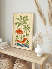 Vintage illustration of green palm trees, orange beach umbrella, lounge chair, and blue waves, in an alternate framed mockup