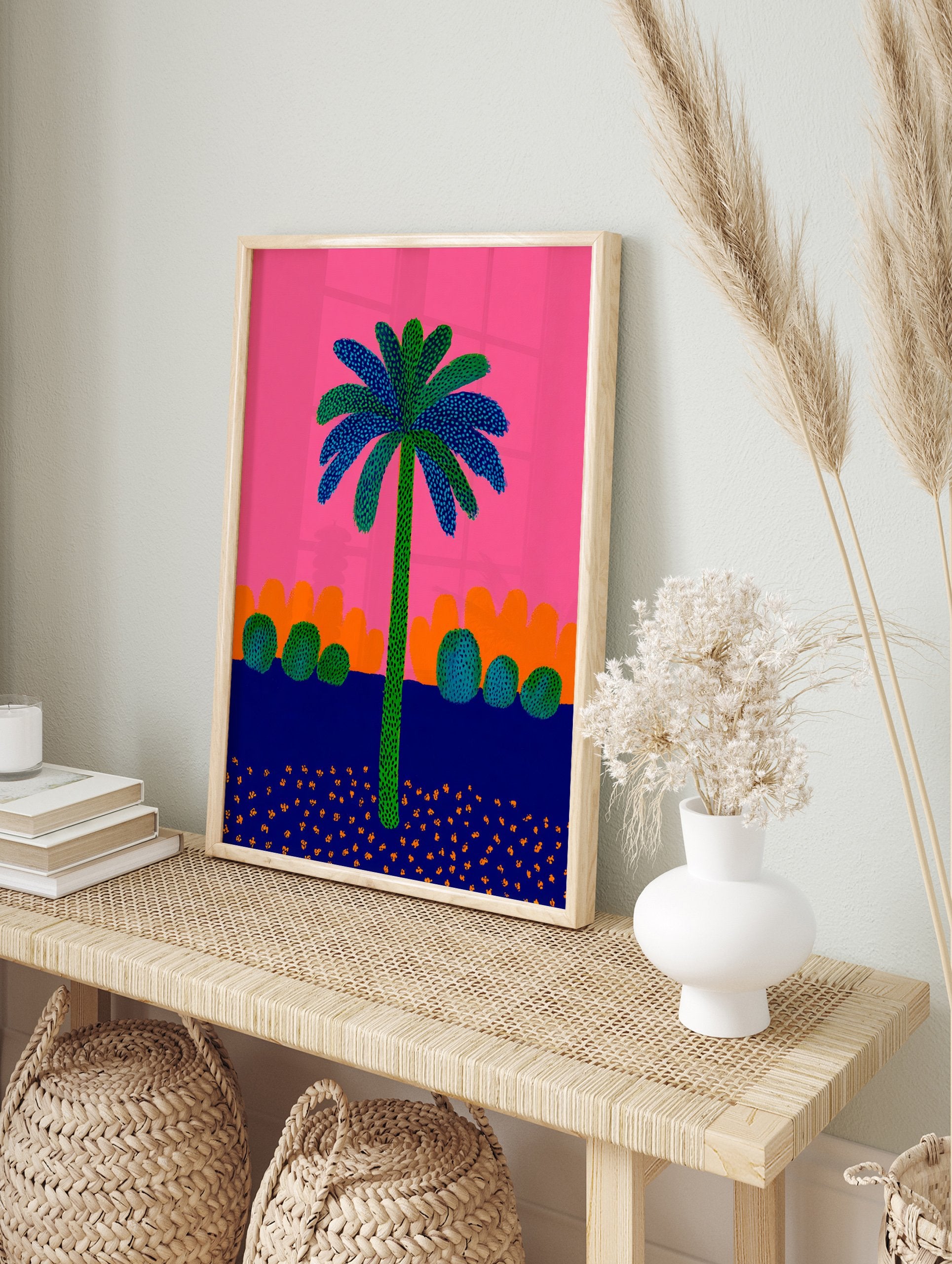 Vibrant palm tree poster with green trunk and blue/green dotted leaves against a bright pink sky, orange hills, and dark blue ground with orange flecks. - Image 4