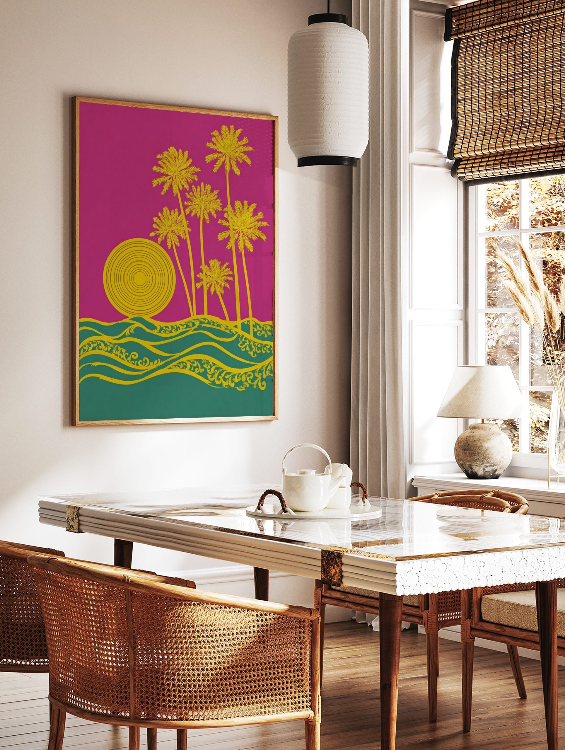 Graphic yellow palm trees, concentric sun, and ornate waves on a pink and teal background, in a styled room mockup