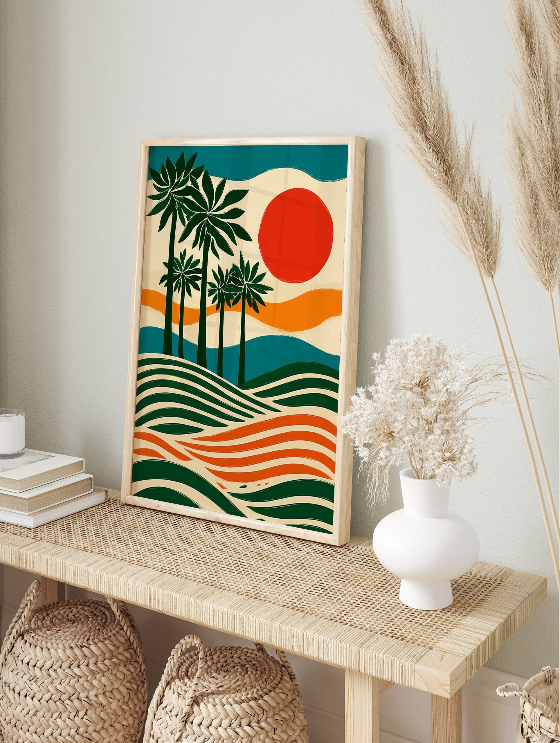 Illustrative palm tree wall art with green trees, orange sun, and wavy stripes in a tropical, in an alternate framed mockup