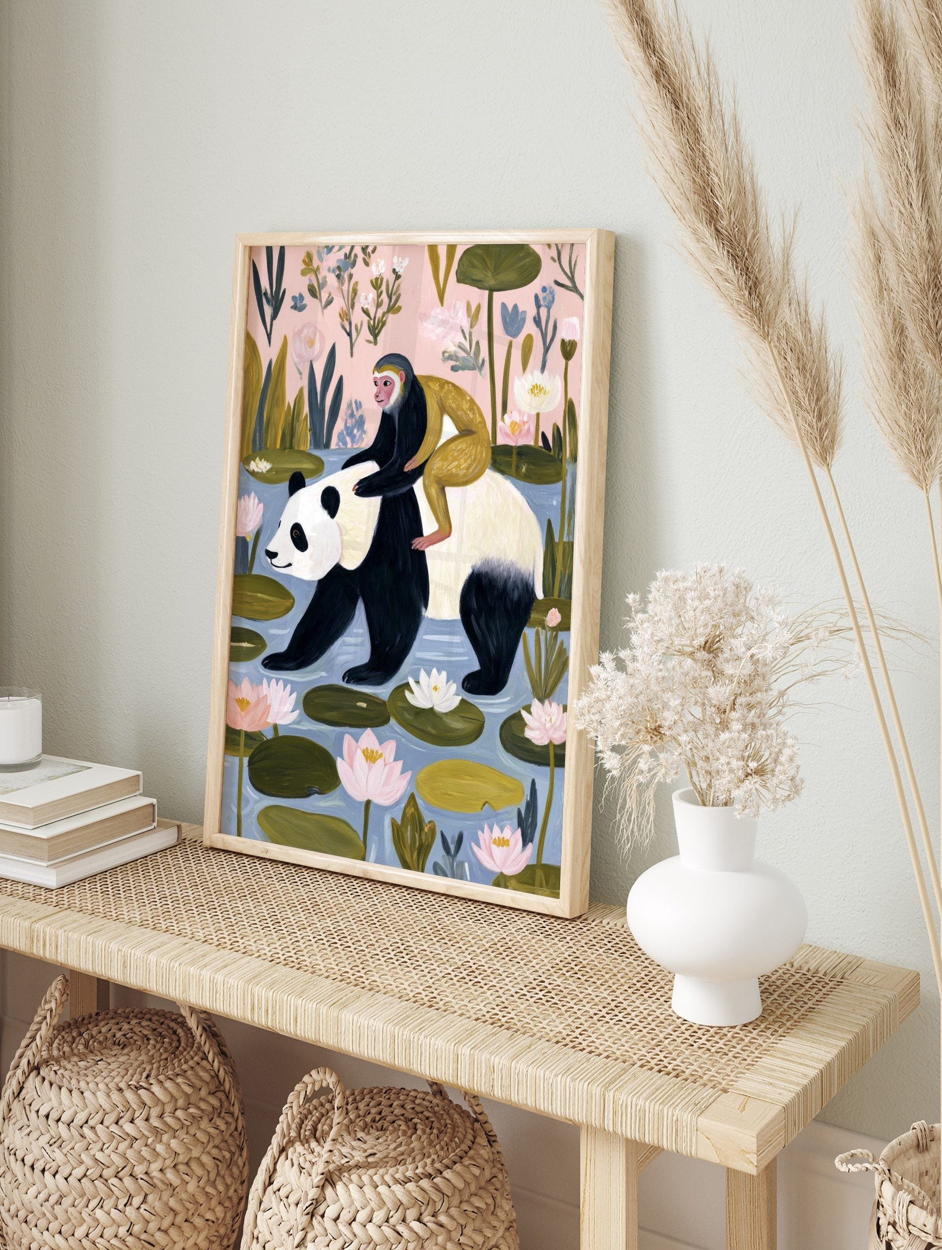 Illustrative print of a panda walking in water with a monkey on its back, surrounded by water, in an alternate framed mockup