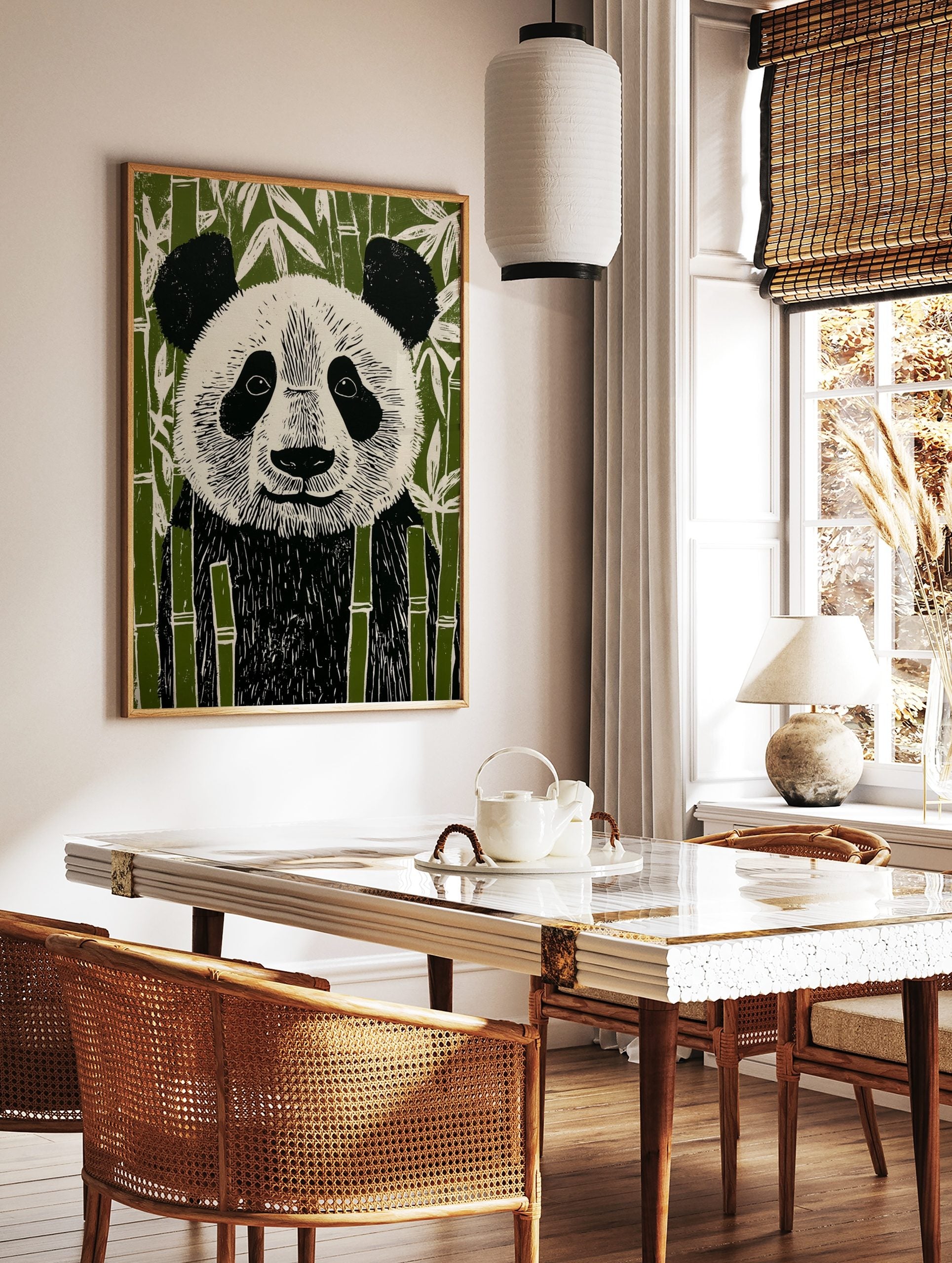 Illustrative linocut style panda bear art print in black, white, and green bamboo forest, in a styled room mockup