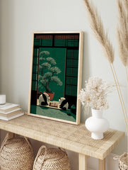 Illustrative print of two pandas playing chess in a Japanese room with a large bonsai tree, in an alternate framed mockup