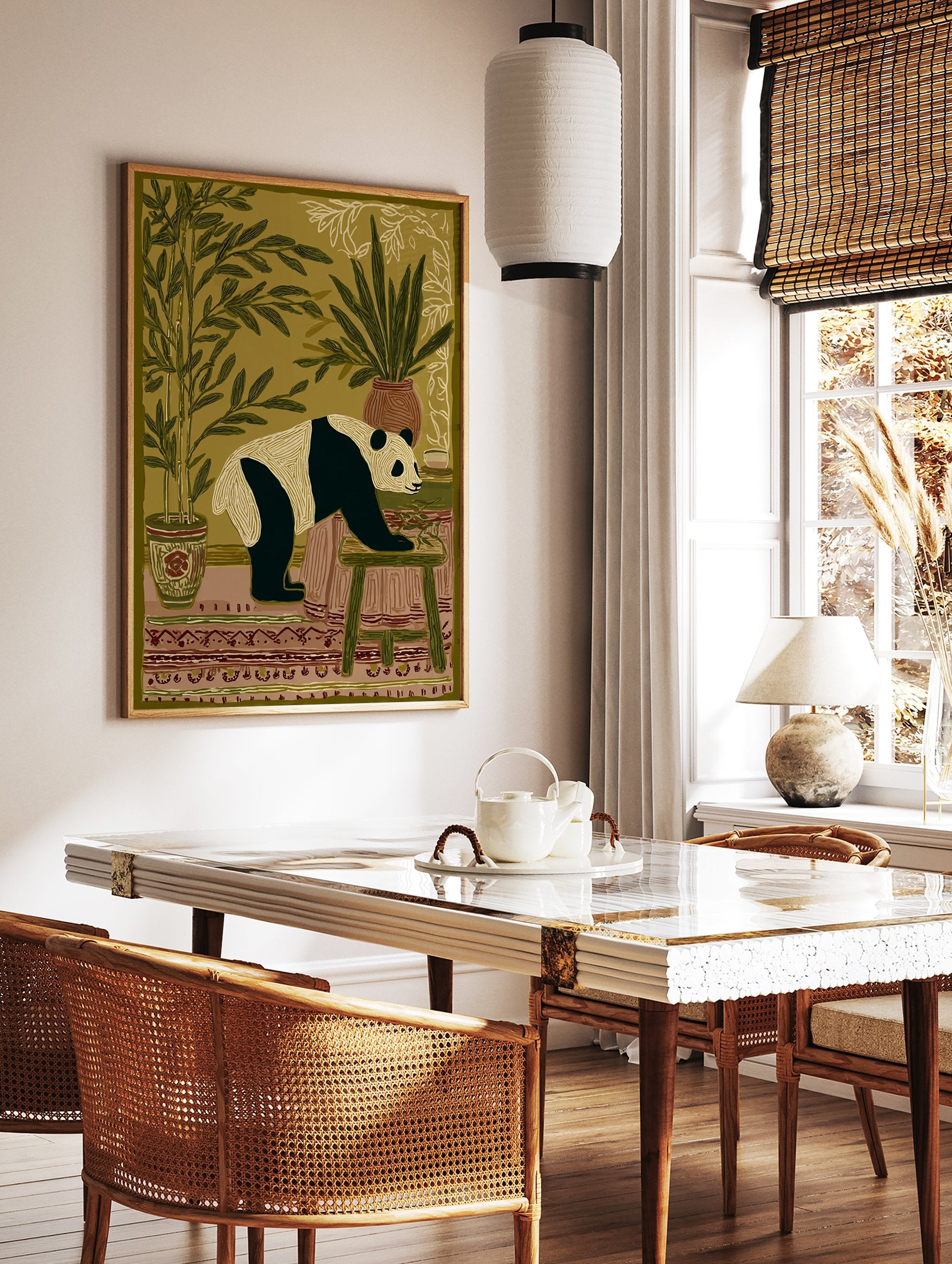 Illustrated panda wall art print in an indoor setting with bamboo plants, a patterned rug, and a stool. - Image 2