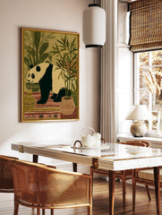 Illustrative panda wall art print with black and beige panda surrounded by green bamboo and plants in earth tone pots. - Image 2