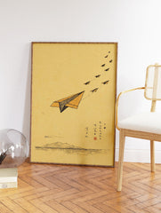 Minimalist paper airplane illustration wall art with mountains and water on a brown background, featuring a lead paper plane. - Image 2