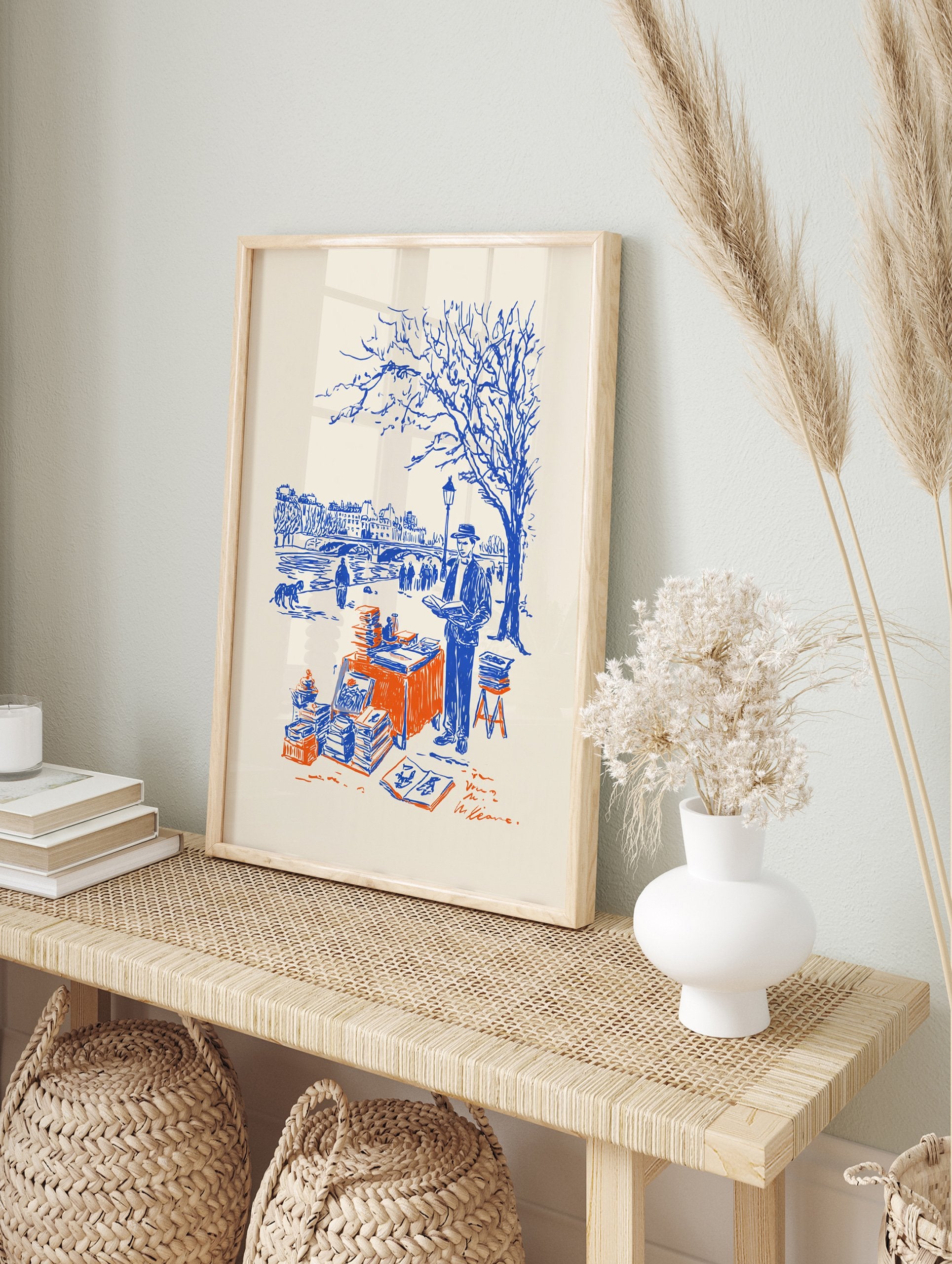 Paris bookseller poster illustration in blue and orange, depicting a bouquiniste by the Seine River with a bridge and city in background. - Image 4
