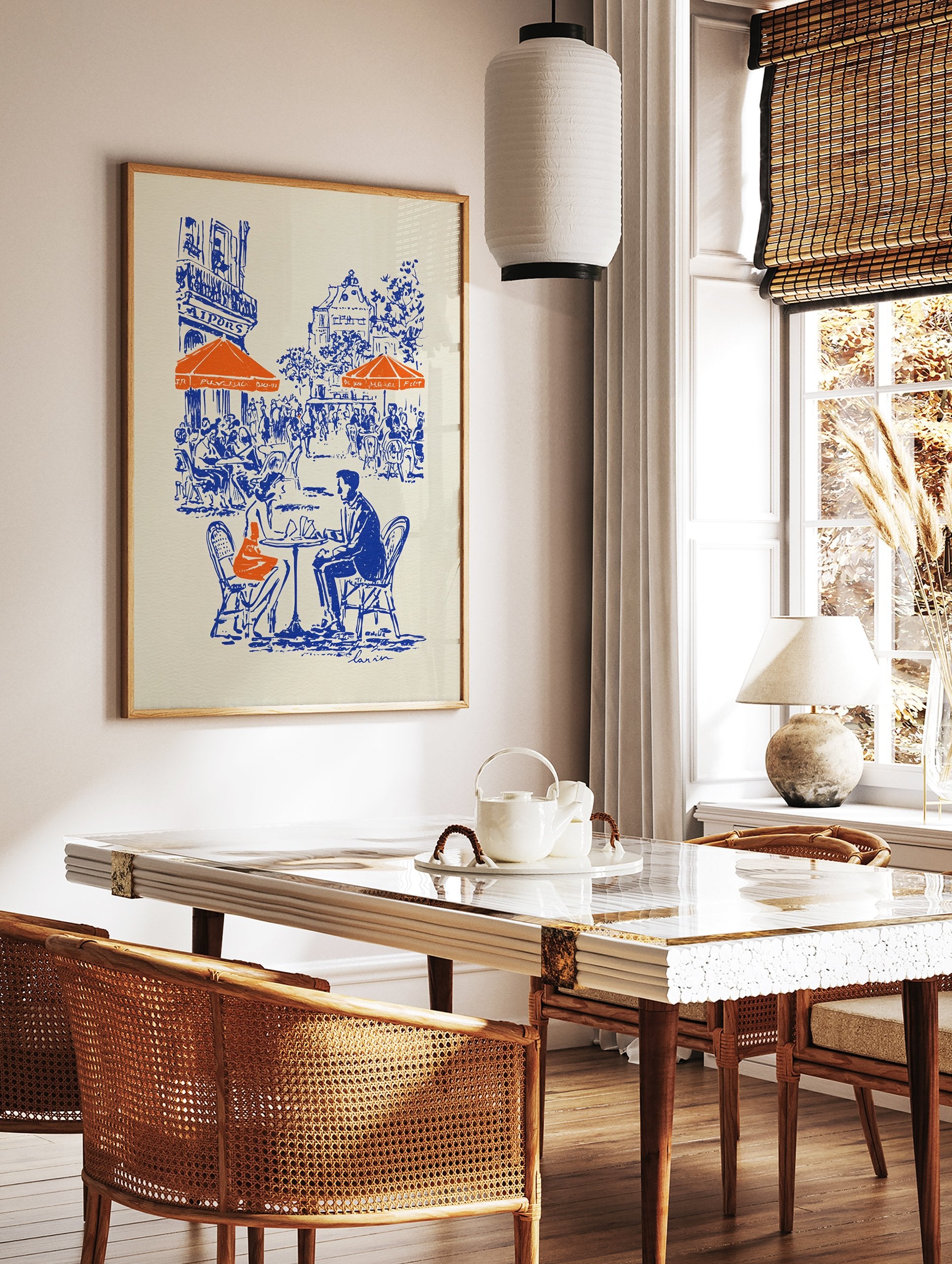 Illustrated blue and orange cafe poster depicting a couple at a Parisian street cafe with buildings in the background. - Image 2
