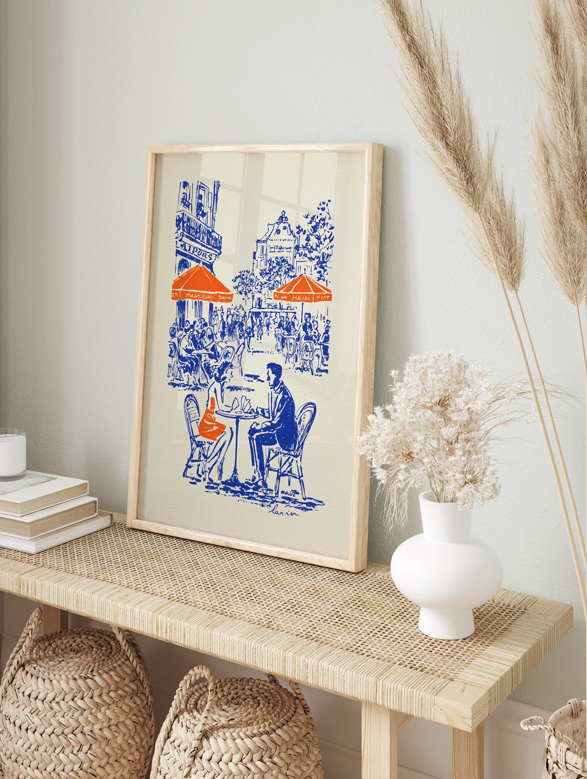 Illustrated blue and orange cafe poster depicting a couple at a Parisian street cafe with buildings in the background. - Image 4