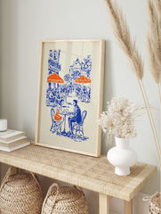 Illustrated blue and orange cafe poster depicting a couple at a Parisian street cafe with buildings in the background. - Image 4