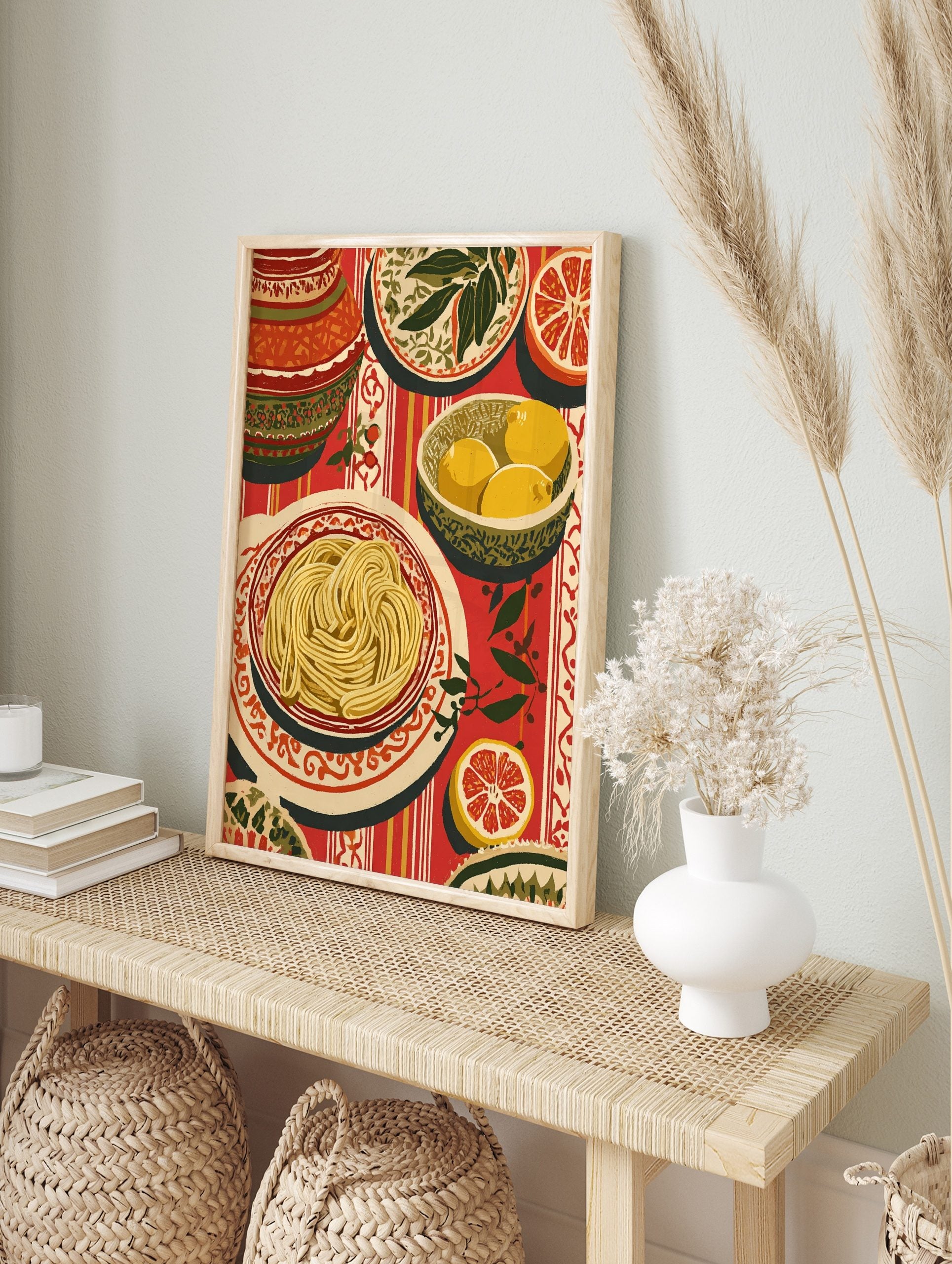 Illustrative still life print of spaghetti, lemons, and grapefruit on a red striped, in an alternate framed mockup