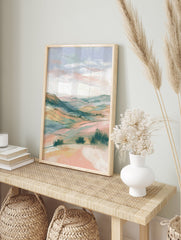 Pastel landscape wall art featuring rolling hills and soft sky with bushes in the foreground, rendered in an illustrative style. - Image 3