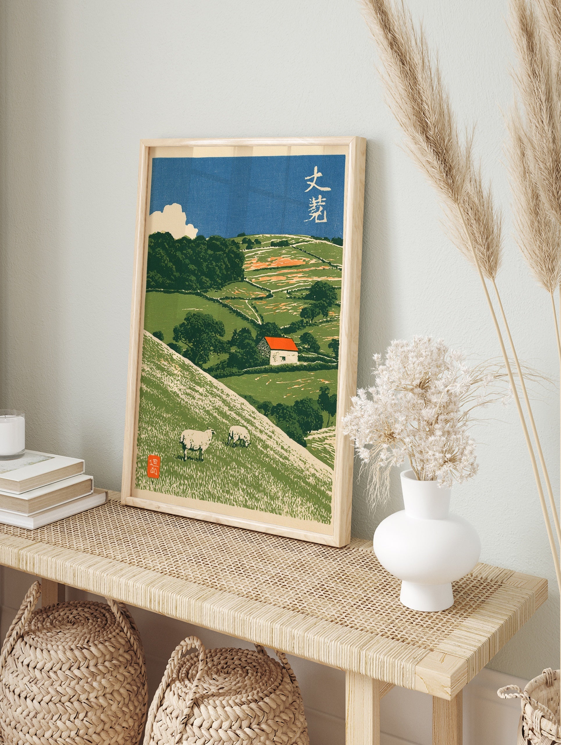 Japanese-style illustrative pastoral landscape art print featuring sheep on green hills and a, in an alternate framed mockup