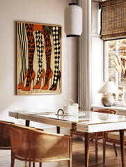Fashion illustration of five pairs of legs wearing striped, diamond, and harlequin patterned, in a styled room mockup