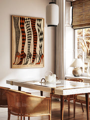 Fashion illustration of five legs in patterned tights and high heels in black, white, and orange, in a styled room mockup