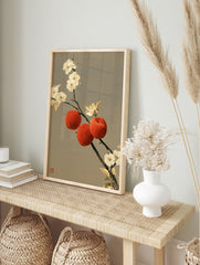 Traditional oriental wall art print featuring three red peaches and white blossoms on a, in an alternate framed mockup