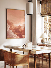 Close-up of voluminous peach and white clouds in a warm sky, appearing dreamy and serene, in a styled room mockup