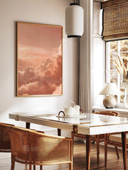 Peach and orange cumulus clouds filling the sky at sunset, a serene and dreamy photographic print, in a styled room mockup
