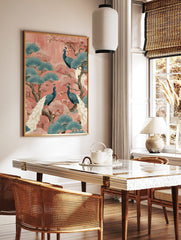 Illustrative wall art print with three teal peacocks, pink blossoms, and blue fan-shaped leaves on, in a styled room mockup
