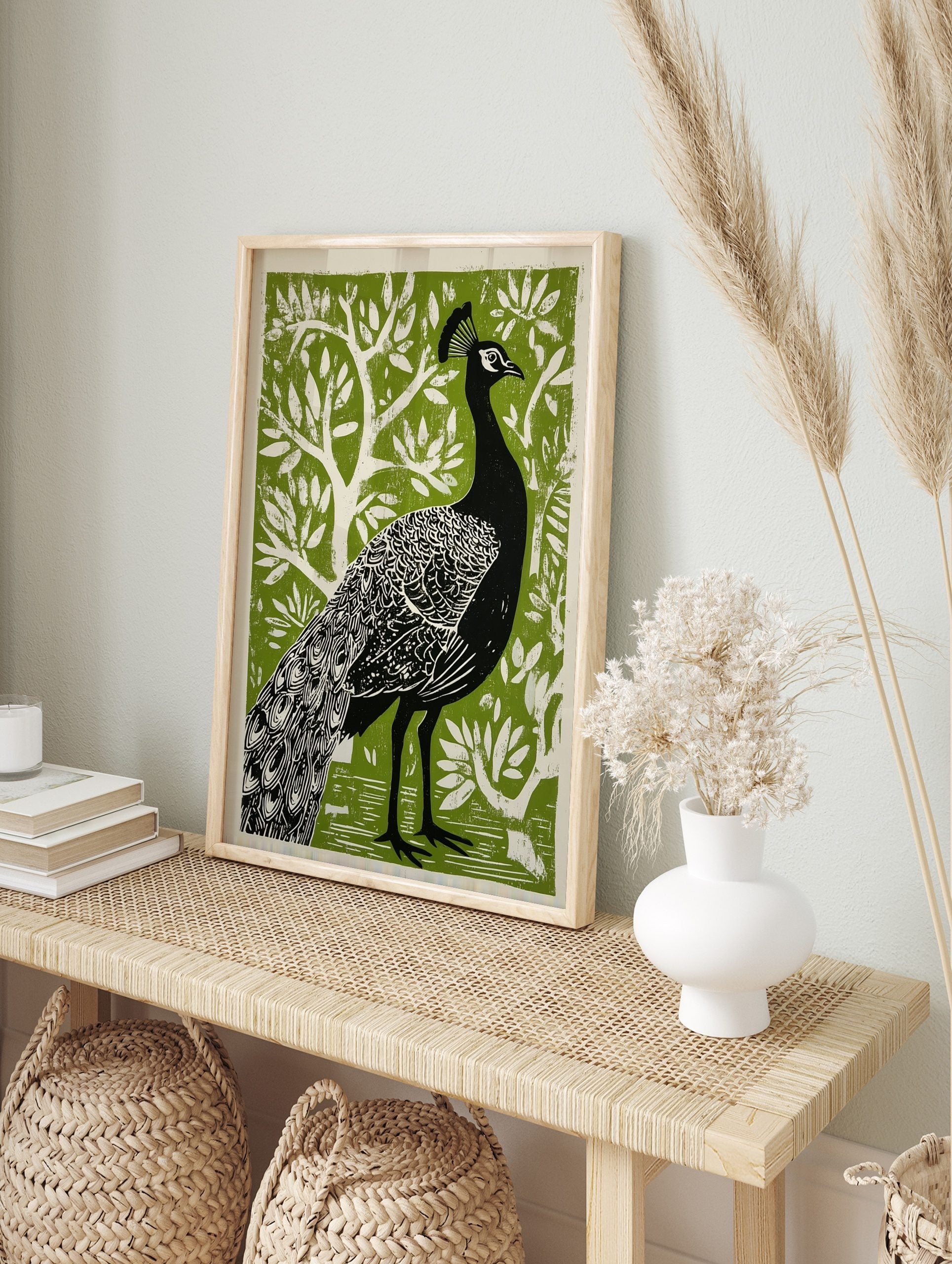 Black peacock with detailed feathers and head crest against a vibrant green stylised tree, in an alternate framed mockup