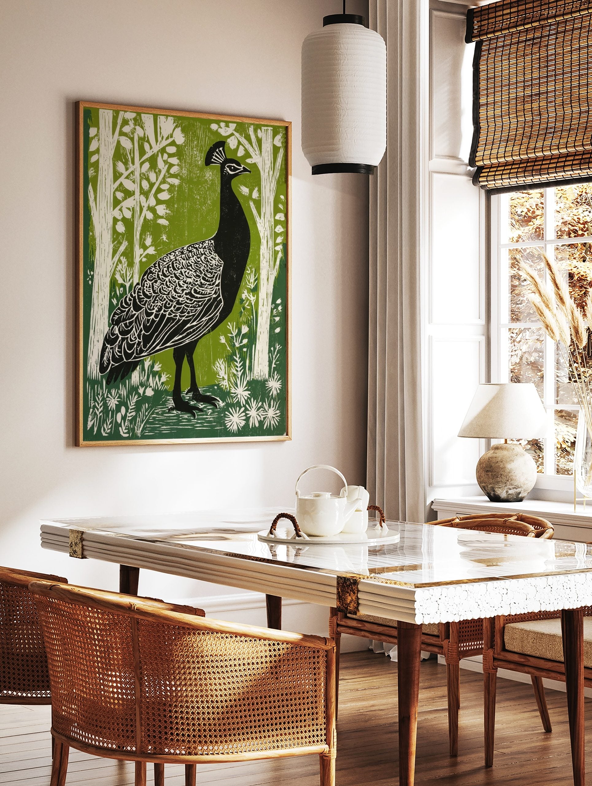 Black peacock with white feather details in green woodland linocut style print, in a styled room mockup
