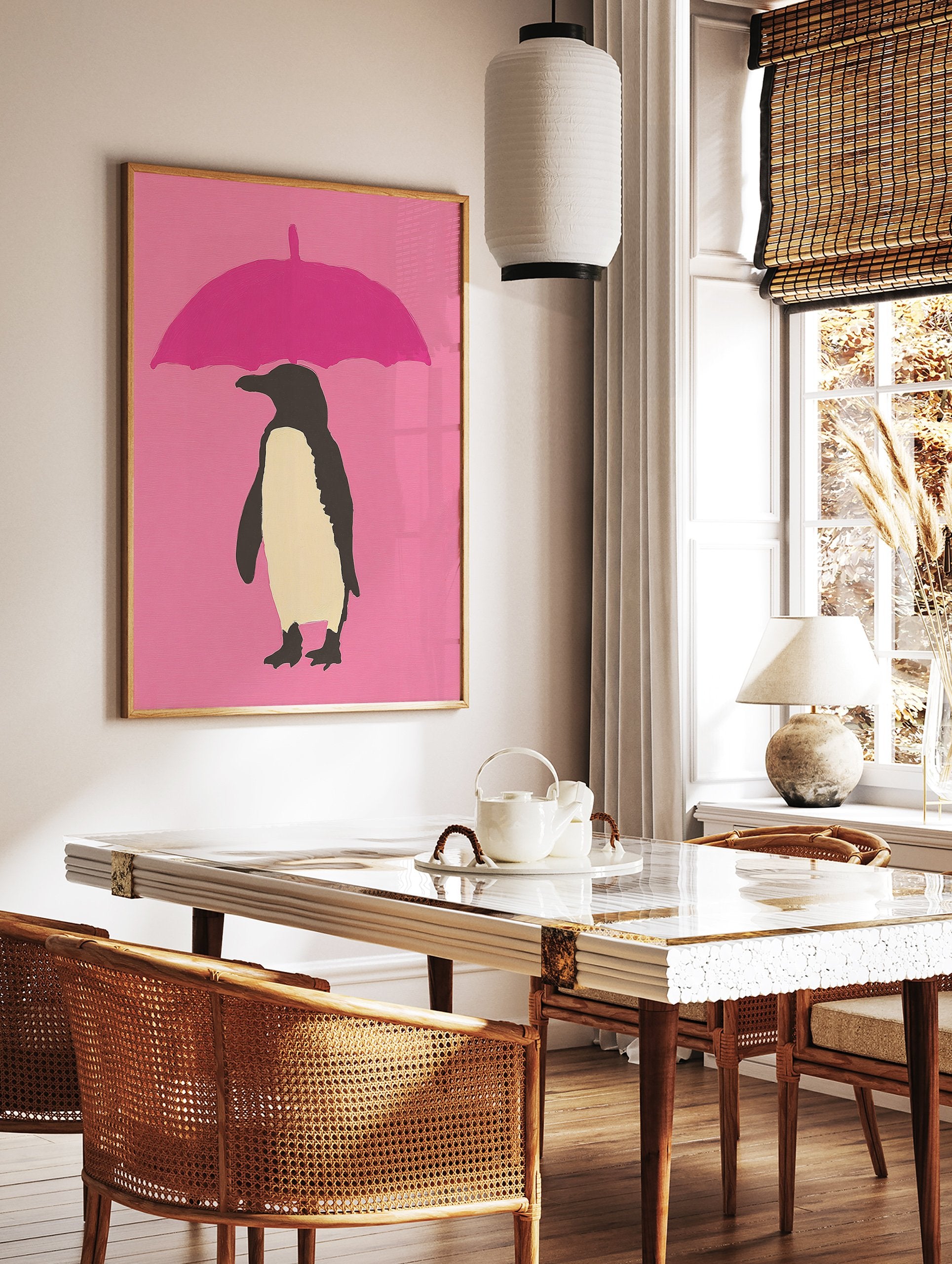 Modern penguin wall art illustration with a black and cream penguin holding a pink umbrella on a pink background. - Image 2