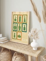Retro perfume bottle wall art with green silhouettes in a grid, featuring vintage cosmetic, in an alternate framed mockup