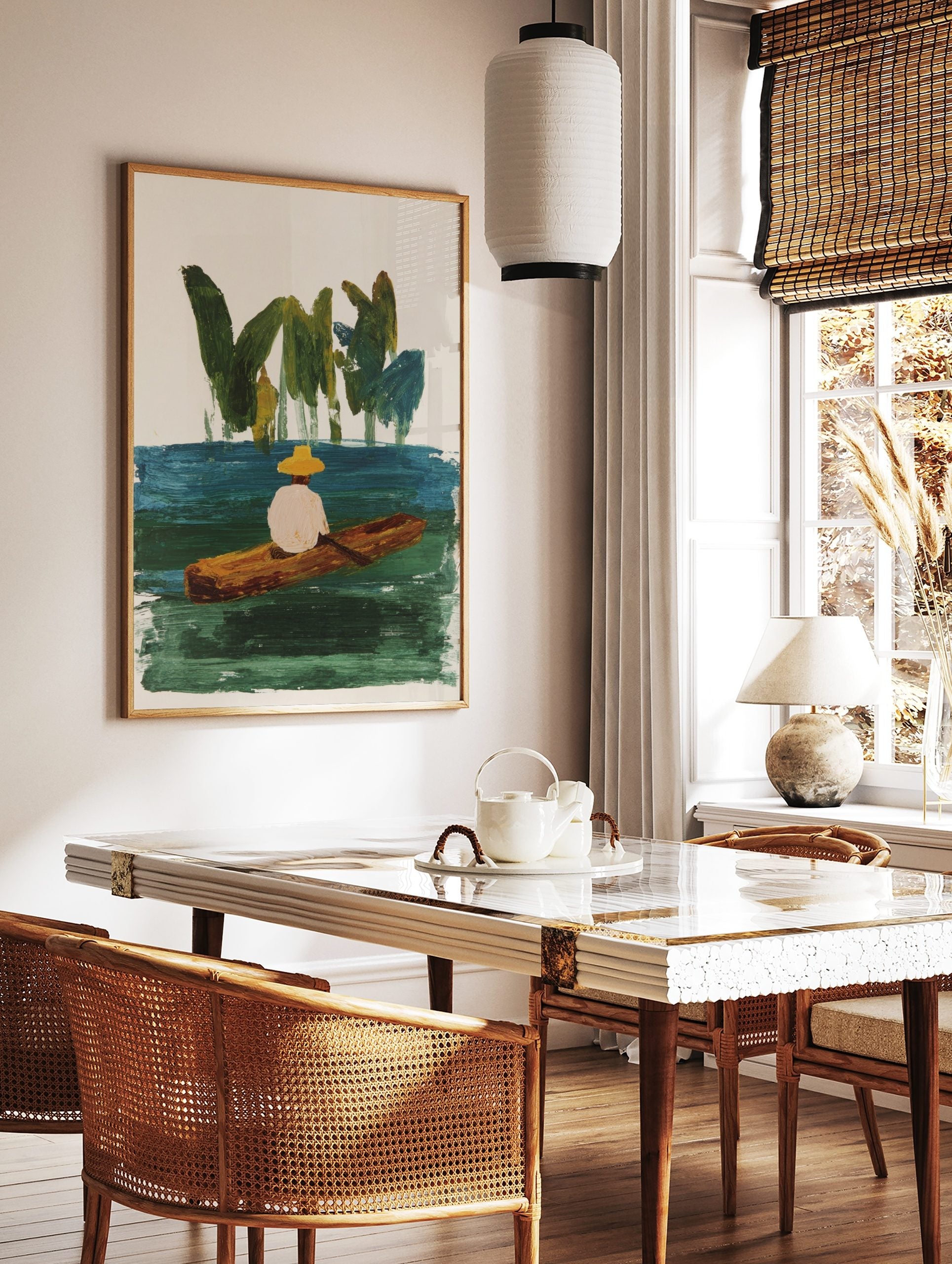 Illustrative painting of person in yellow hat in wooden boat on green-blue water with green foliage, in a styled room mockup